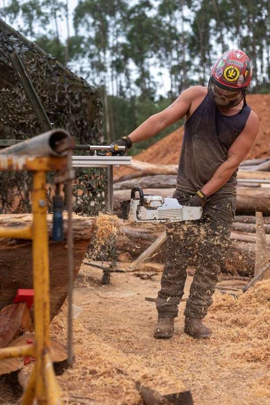 Chainsaw milling, with the guide frame above the timber.